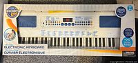 Front view of boxed Discovery Kids electronic keyboard showing keyboard keys and control panel.