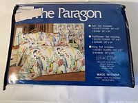 Picture of packaging showing the brand, size options, and product details for the Paragon duvet cover and sham set.