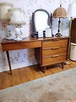 Front view of desk showing three drawers and top surface