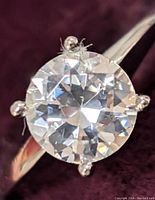 Top-down view of round moissanite in four-prong setting