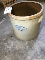 Full view of the Hart & Lazier 3 gallon stoneware crock showing beige stoneware body, brown glazed rim, handle, and overall shape.
