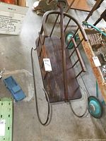 View from above showing wooden seat and metal runners with aged wood and rustic metal finish.