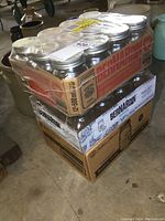 Three stacked cardboard boxes containing new Bernardin Mason 500ml canning jars with metal snap lids, unopened and shrink wrapped.