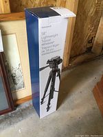 Photo of the box showing Insignia brand and 58-inch lightweight tripod