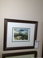 Framed print seen hanging on wall showing entire frame and print dimensions.
