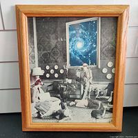 Image of the framed collage art showing a surreal black and white room with a galaxy through the window and several animals and human figures.