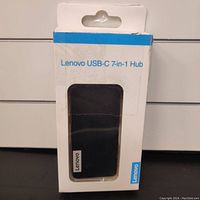 View of Lenovo USB-C 7-in-1 hub in original box with Lenovo logo and product label visible.
