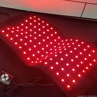 Naviocean Red Light Therapy Wrap turned on showing red LED lights