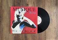 Front view of The High Road LP vinyl record with album cover and record partially out.