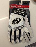 Rawlings Youth 5150 Medium Leather Baseball Batting Gloves showing front side with Rawlings logo and digital camo pattern, new with packaging.