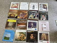 Photo showing a collection of 15 classical music vinyl records featuring composers like Mozart, Beethoven, Brahms, Handel, Liszt, and others, with various classical series and library collections.