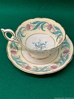 Tea cup and saucer shown together from a top angle to display interior patterns and overall design.