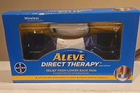 Front view of Aleve Direct Therapy device packaged in its original box with branding and product details visible