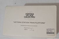 Box for the Department 56 Heritage Village Collection 'Victoria Station Train Platform' porcelain accessory.