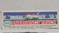 Box showing the Hess Emergency Truck branding, illustration, and feature list.