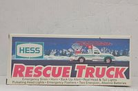 Photo of the original box showing Hess Rescue Truck branding and features list