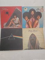 Four vinyl record albums including Sheena Easton, The Three Degrees, Pink Floyd, and Black Moses.