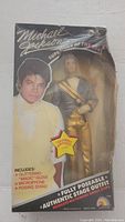 Front view of original box showing Michael Jackson figure and packaging damage.