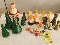 Full lot view showing all candles and candle holders including Santa, Christmas trees, angels, and other figures