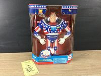 Full front view of Buzz Lightyear figure in original box with Stars and Stripes costume.