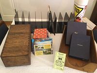 Overall view of lot showing wooden storage box, postcards, Crane stationary boxes, file sorters and other stationery items.