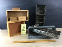 Overview photo of multiple rustic wood and metal storage pieces including wooden boxes, metal trays, and compartments along with a wooden ruler for scale.