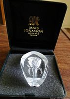 Crystal glass decoration with an engraved rose inside, displayed in original Mats Jonasson box with logo inside lid.