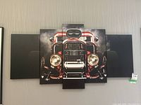 Five-panel canvas wall art depicting a vintage red car front with chrome details and smoky background, displayed on a wall.