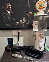 Full lot with White Rose metal model gas pump, lighter, and pocket cutlery.