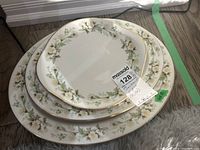 Stack of three Royal Doulton Clairmont dishes showing a large oval platter, medium platter, and handled cake plate