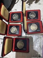 Five opened presentation cases displaying 1972 Canadian silver dollars