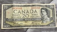 Front view of the 1954 Canadian $20 bill showing Queen Elizabeth II portrait and serial numbers.
