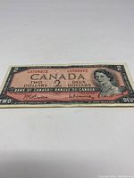 Front side of 1954 Canadian two dollar bill showing detailed portrait and denomination.