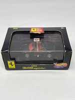 Front view of the boxed 1993 Ferrari 348 Spider Hot Wheels diecast model, showing the black packaging with Ferrari and Hot Wheels logos.