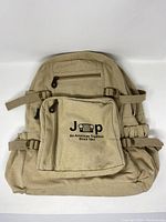 Front view of vintage Jeep Rothco backpack showing the front zippered pocket with logo.
