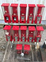 Dual-row stand with ten machines mounted and two additional machines on deck