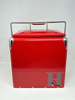 Front view of the red retro mini drink cooler showing the Cool H logo with loon.
