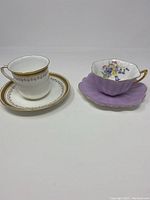 Both Shelley teacup and saucer sets shown side by side on white background.