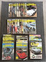 40 vintage Thoroughbred & Classic Cars magazines arranged in three rows, various months and years from 1976 to 1987, covers feature classic cars like Jaguars, Fords, and muscle cars.