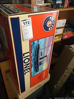 Box front with colorful artwork of the tugboat and Lionel branding.