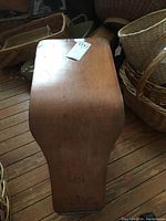 Top view of the wooden shoe stool showing wood grain and surface wear.