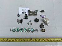 Overview of all jewellery pieces with ruler for scale