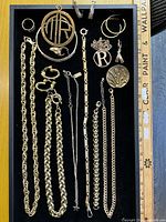 Full tray view showing all gold tone jewellery pieces