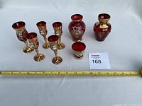 Entire set laid out with measuring tape for scale