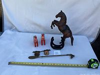 All items laid out with measuring tape for scale