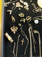 Tray of mixed gold-tone jewellery pieces including chains, pendants, earrings, Speidel clasp and findings