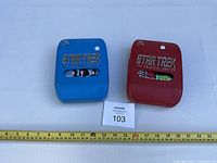 Front view of both DVD sets showing logos and disc windows