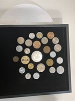 All coins arranged on black background showing obverse designs
