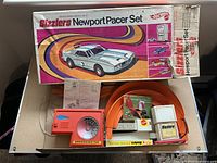 Box lid with track set components visible