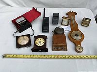 Overall lot with all devices aligned and measuring tape for scale